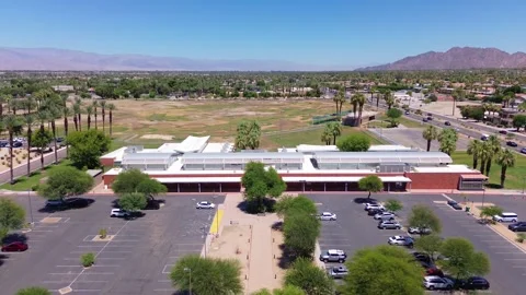 Drone Approaches Palm Desert Library Near College of the Desert and the Video stock 339080365