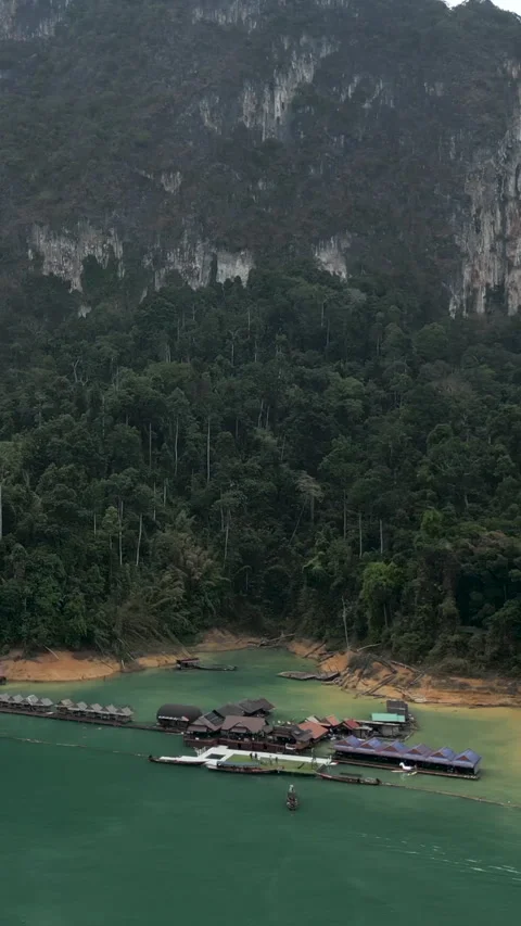 The drone approaches a small dock between mountains Stock Footage 267594645