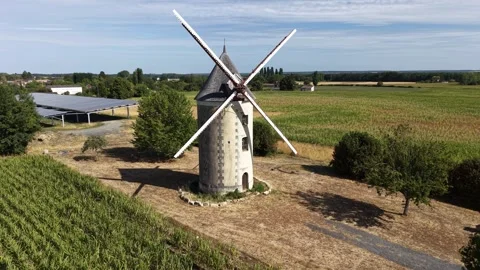 Drone Approaches Stone Windmill Across French Farmland Stock Footage 345151257