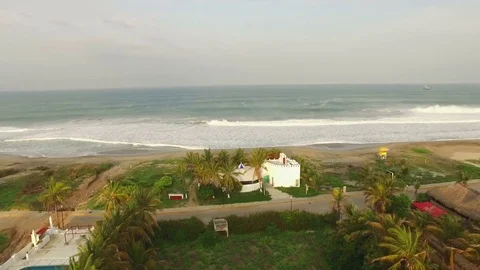 The drone is approaching  the beach flying over vegetation, Mexico. Aerial Stock Footage 72108167