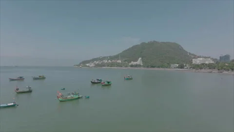 Drone approaching boat with hills behind Stock-Footage 346611341
