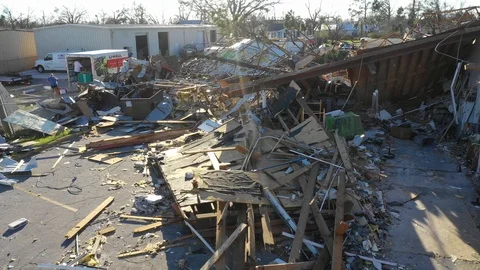 Drone approaching a building in ruins after the passage of Hurricane Michael Stock-Footage 98790380
