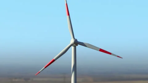 Drone approaching close to wind turbine working against summer clear sky Video stock 153050000