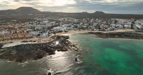 Drone approaching Corralejo boach over the sea Stock Footage 345422228