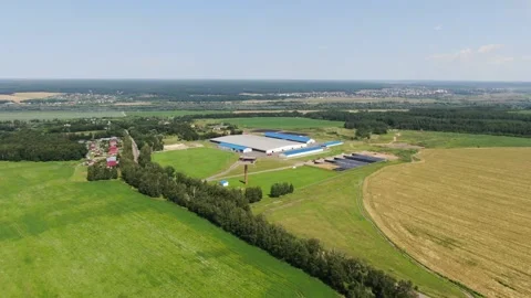 Drone approaching farm complex with gradual descent Stock Footage 333278815