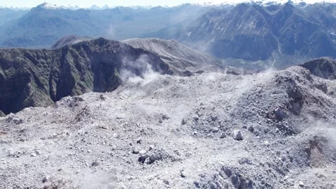 Drone approaching the fumaroles from the top of the Chaitén volcano. Stock Footage 249012395