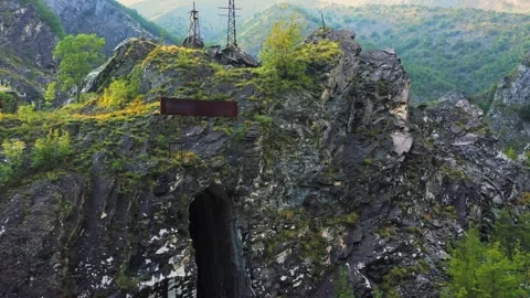 Drone approaching high rock of abandoned marble quarry in Carrara, Italy. Stock Footage 250340989