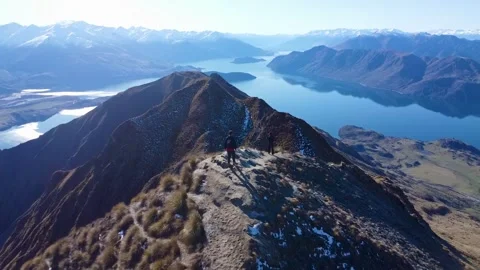 Drone Approaching Hikers on Roys Peak Ridge Stockbeeldmateriaal 337473527
