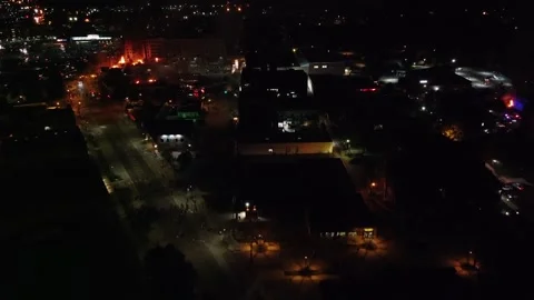 Drone approaching hot war zone with fires on the left and on the right of screen Stock Footage 134505941