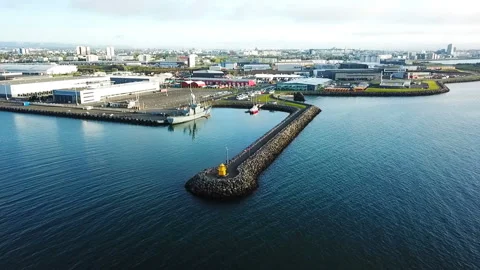 Drone approaching the lighthouse and port with ships Reykjavik Iceland. Vídeo Stock 90904579