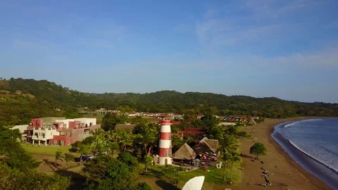 Drone approaching lighthouse on the coast of Playa Venao during sunset Stock Footage 85360661