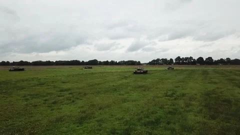 Drone approaching line of old tanks in German army training field Stock Footage 341862135