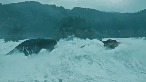 Drone Approaching Massive Waves Crashing into Coastal Rocks Stock Footage 315099021