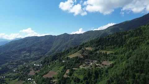 Drone approaching mountain peak near village houses, Adjara 스톡 동영상 337341101