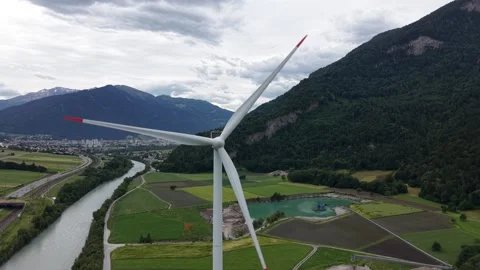 Drone Approaching Rotating Wind Turbine in Mountain Landscape Video stock 336367190