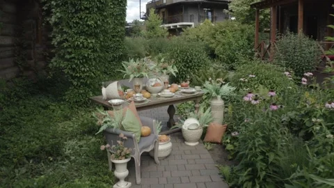 Drone approaching rustic pumpkin table setup Stock-Footage 329540308