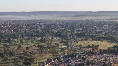 Drone approaching small city from rural countryside Stock Footage 330126201