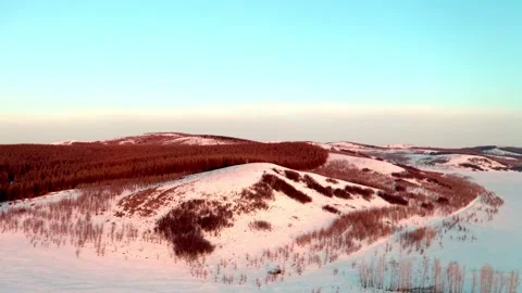 Drone Approaching Snow Covered Forested Hills Vídeo Stock 344955897