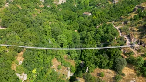 Drone Approaching Suspension Bridge Over Gorge Stock Footage 344470423