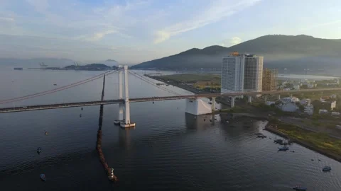 Drone approaching Thuan Phuoc Bridge at sunrise, Da Nang, Vietnam Stock Footage 340874877