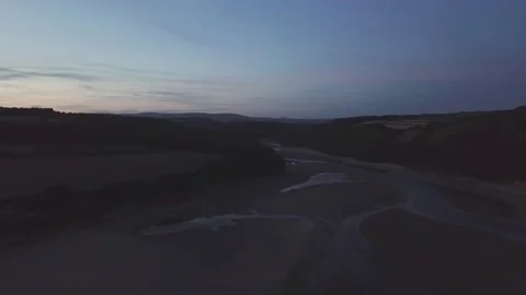 Drone arc over beach into rolling fields, south devon,uk 4k Stock Footage 320946427