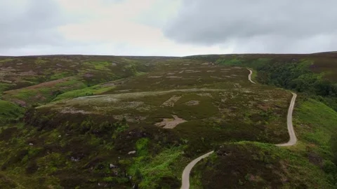 Drone ariel point of view. Derbyshire Peak District moorlands with winding .. Stock Footage 240180479