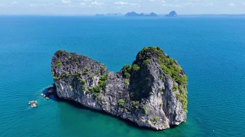 Drone around karst mountain in turquoise waters, Koh Ngai – 4K Stock Footage 325022365