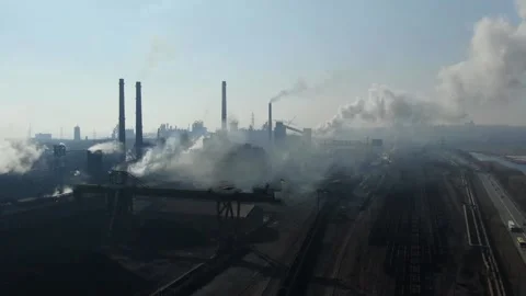 Drone around toxic enterprise chimneys tubing against the sky background rele Stock Footage 149352018