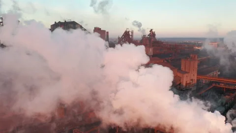 Drone around toxic enterprise chimneys tubing against the sky background release Video stock 167511538