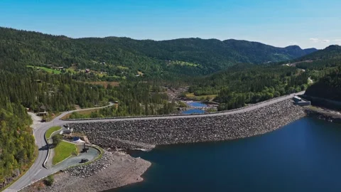 Drone Ascend Over Huge Rock Dam, Reservoir and Forested Mountain Valley Stock Footage 318811251