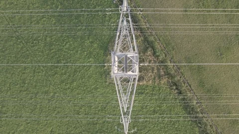Drone Ascending Above Electricity Pylon with Rotating Overhead View Stock Footage 339075434