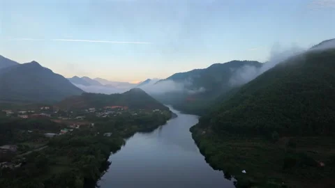 Drone Ascending Above Misty River Valley At Sunrise In Vietnam Stock Footage 336857341
