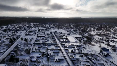 Drone Ascending Above Snow Covered Rural Area in Northern Europe During Winter Stock Footage 335686904