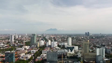 Drone Ascending and Forward Flight Over Surabaya Skyline, Indonesia Stock Footage 315235451