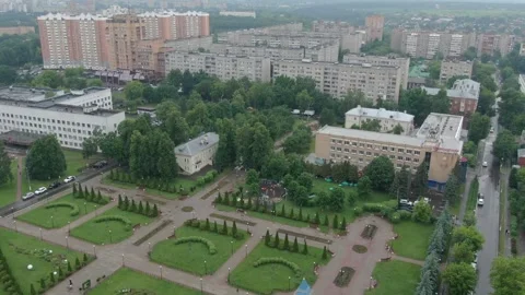 Drone ascending and moving backward above park area in Podolsk Stock Footage 327685019