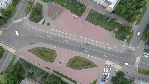 Drone ascending and rotating above city square Stock Footage 332684068