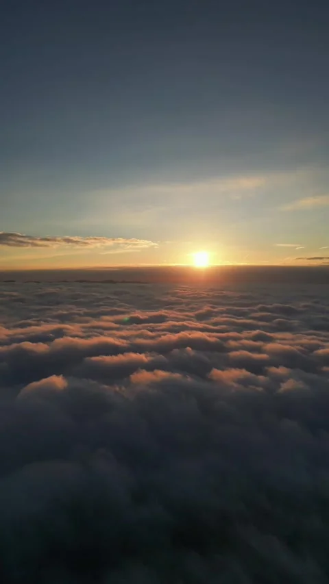 Drone Ascending into a Bright Sky Over the Clouds Vidéo 296738205