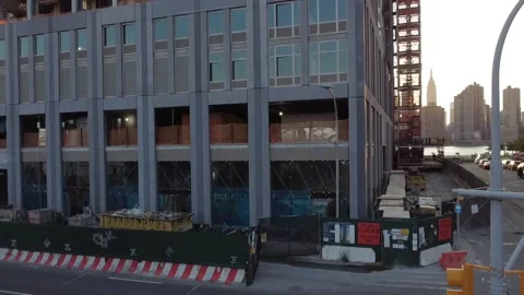 Drone ascending a construction site from ground up Stock Footage 138956546