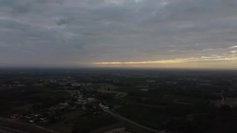 Drone ascending to high altitude with sun rays in France Stock Footage 331710219