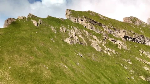 Drone Ascending from Meadow to Seceda Mountain in the Dolomites Stock Footage 313891984