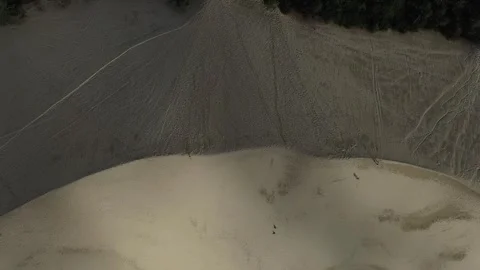 Drone Ascending Over Dune du Pilat Revealing Sand Patterns and Landscape Stock Footage 331661671
