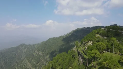 Drone ascending over forest and rocky area Stock Footage 159502635