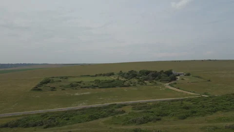 A drone ascending over the green fields. Stock Footage 263483980