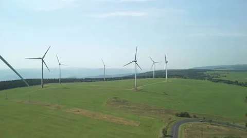 Drone Ascending Over Landscape with Multiple Wind Turbines Stock Footage 314940403