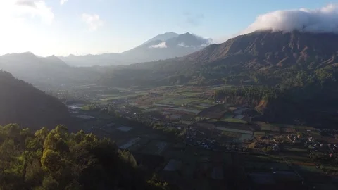 Drone Ascending Over Mountain Valley and Farmland Sunrise, Indonesia Stock-Footage 333610352