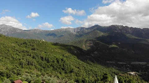 Drone Ascending Over Remote Corsican Village Revealing Vast Deserted Mountain Vidéo 331662064