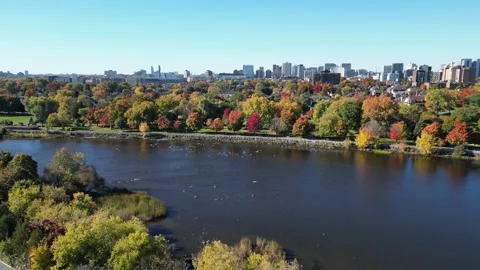 Drone ascending over river city scape fall Stock Footage 314616093