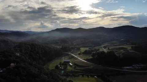 Drone Ascending over Road Snaking Through Mountains Stock Footage 94132682