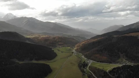 Drone ascending over snow-covered mountain landscapes in France Stock Footage 331709683