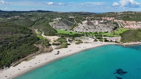 Drone Ascending Over Turquoise Beach on a Sunny Day Stock Footage 334167187